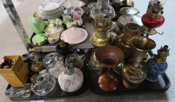 Assorted oil lamps including a Chinese blue and white example with Kosmos Brenner wheel, a copper