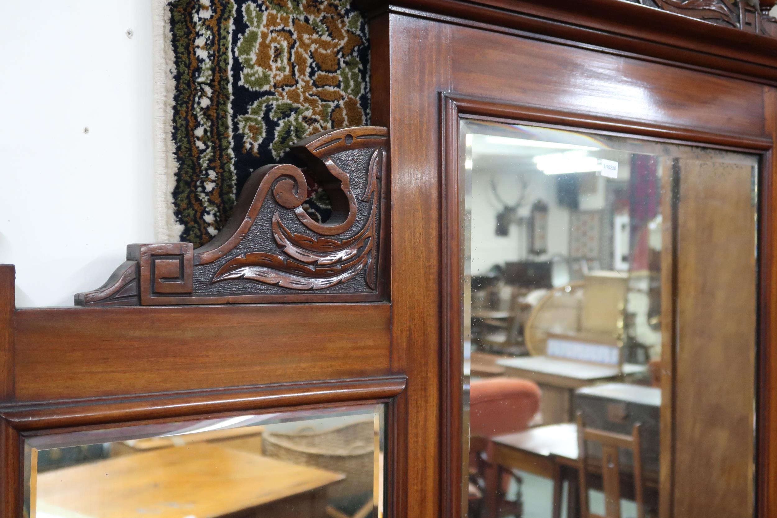 A late Victorian mahogany mirror back sideboard with carved surmount over bevelled mirror panes on - Image 4 of 4