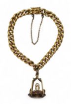 A 14k gold gold curb chain bracelet, with an attached smoky quartz and yellow metal pendant,