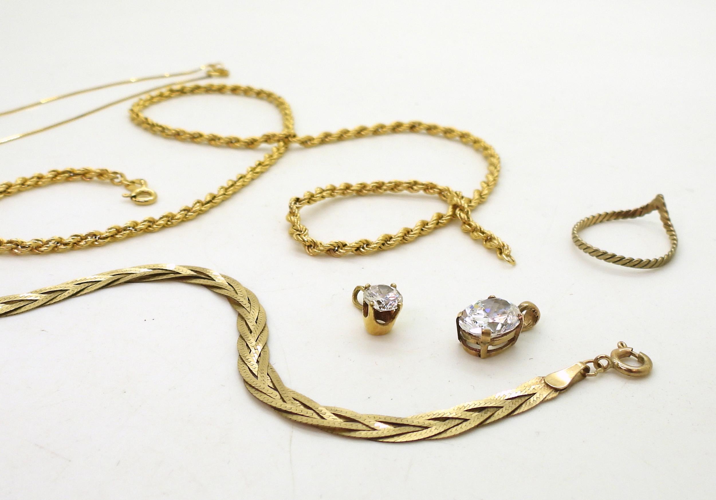 A collection of gold and yellow metal to include a braided 9ct bracelet, 9ct rope chain a - Image 3 of 3