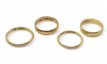 Four 18ct gold wedding rings, sizes S1/2, P, O1/2 and O, weight combined 14.4gms Condition Report: