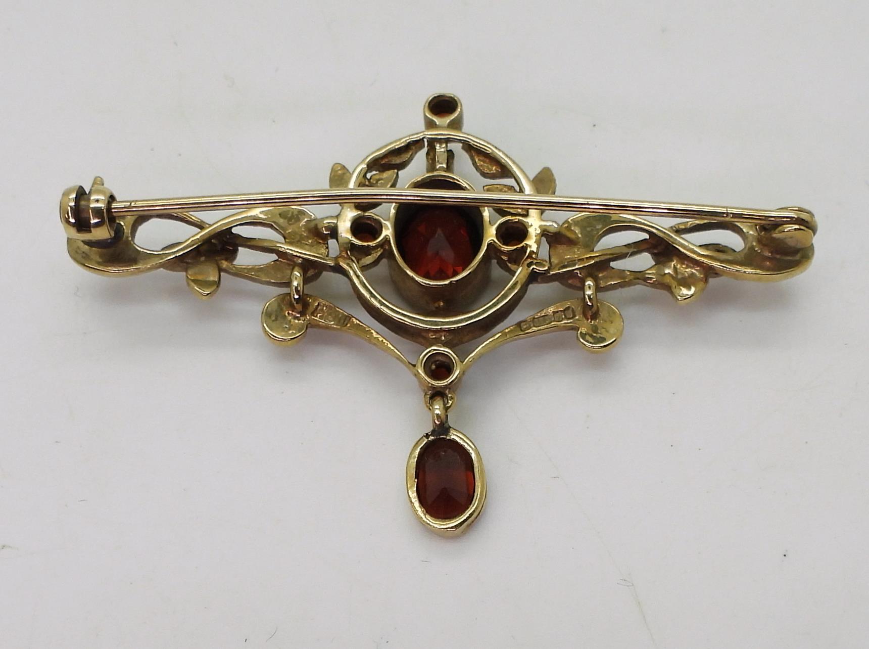 A 9ct gold garnet and pearl Art Nouveau style brooch, length 5cm, weight 5.5gms Condition Report: - Image 4 of 4
