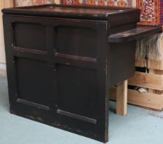 An early 20th century stained pine ecclesiastical style corner table with panelled back, 83cm high x