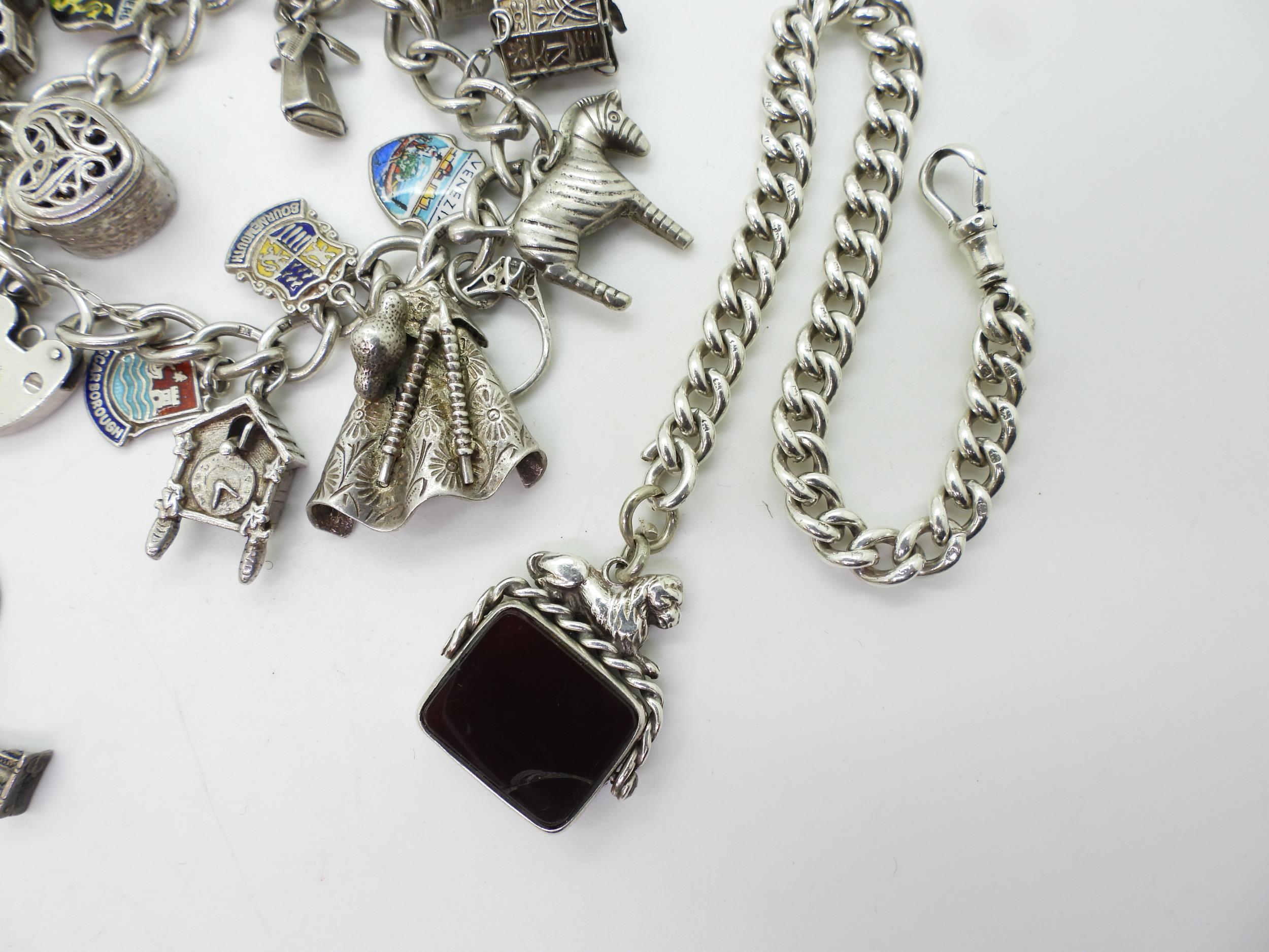 Two silver and white metal charm bracelets together with a silver fob chain bracelet with attached - Image 2 of 3