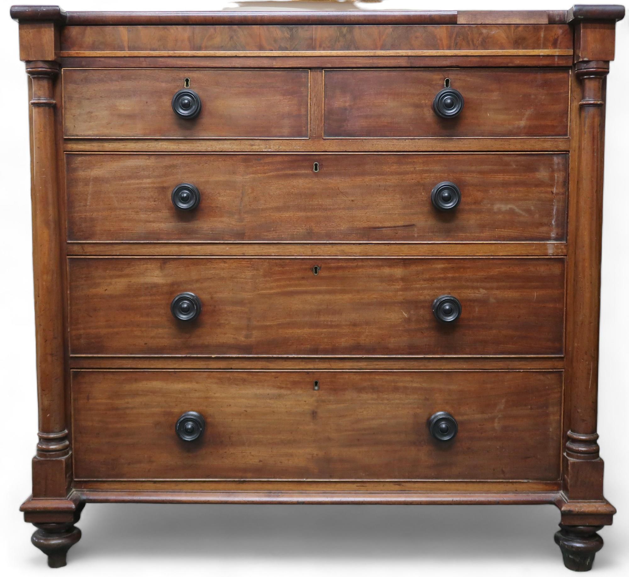 A late Victorian mahogany and walnut veneered chest of drawers with single long frieze drawer over