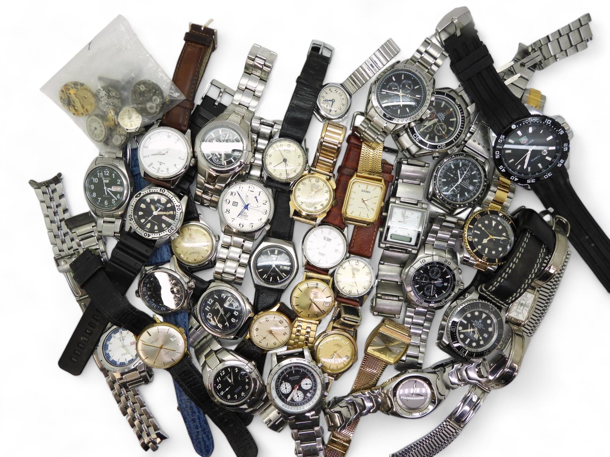A collection of gents fashion watches to include Seiko, Roamer, Astral, Mido and replica watches.