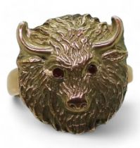 A 9ct gold buffalo head ring with red gem eyes, size approx Q, weight 7.8gms Condition Report: