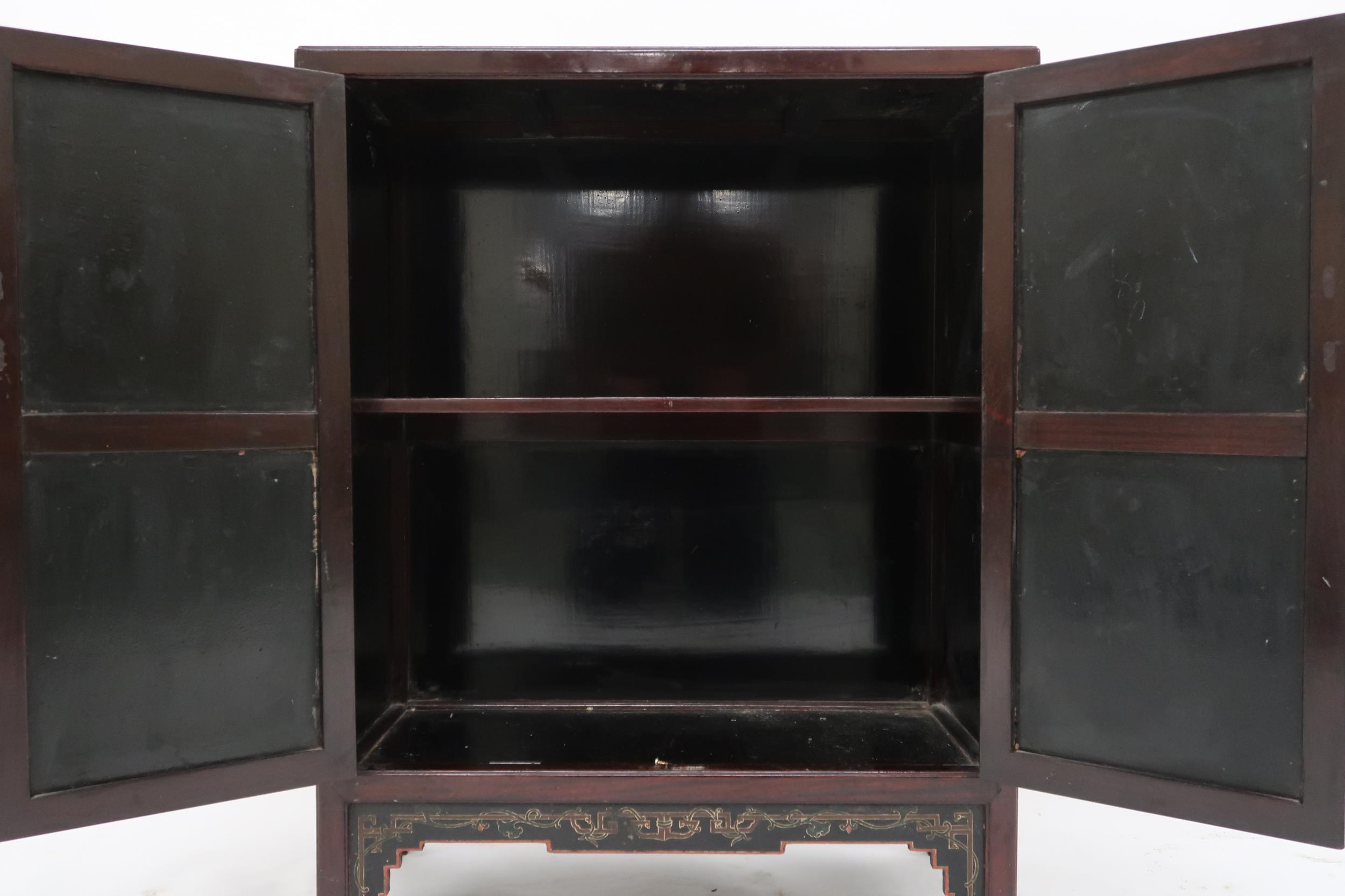 A 20th century Chinese hardwood two door side cabinet with lacquered panel top, sides and doors - Image 2 of 2