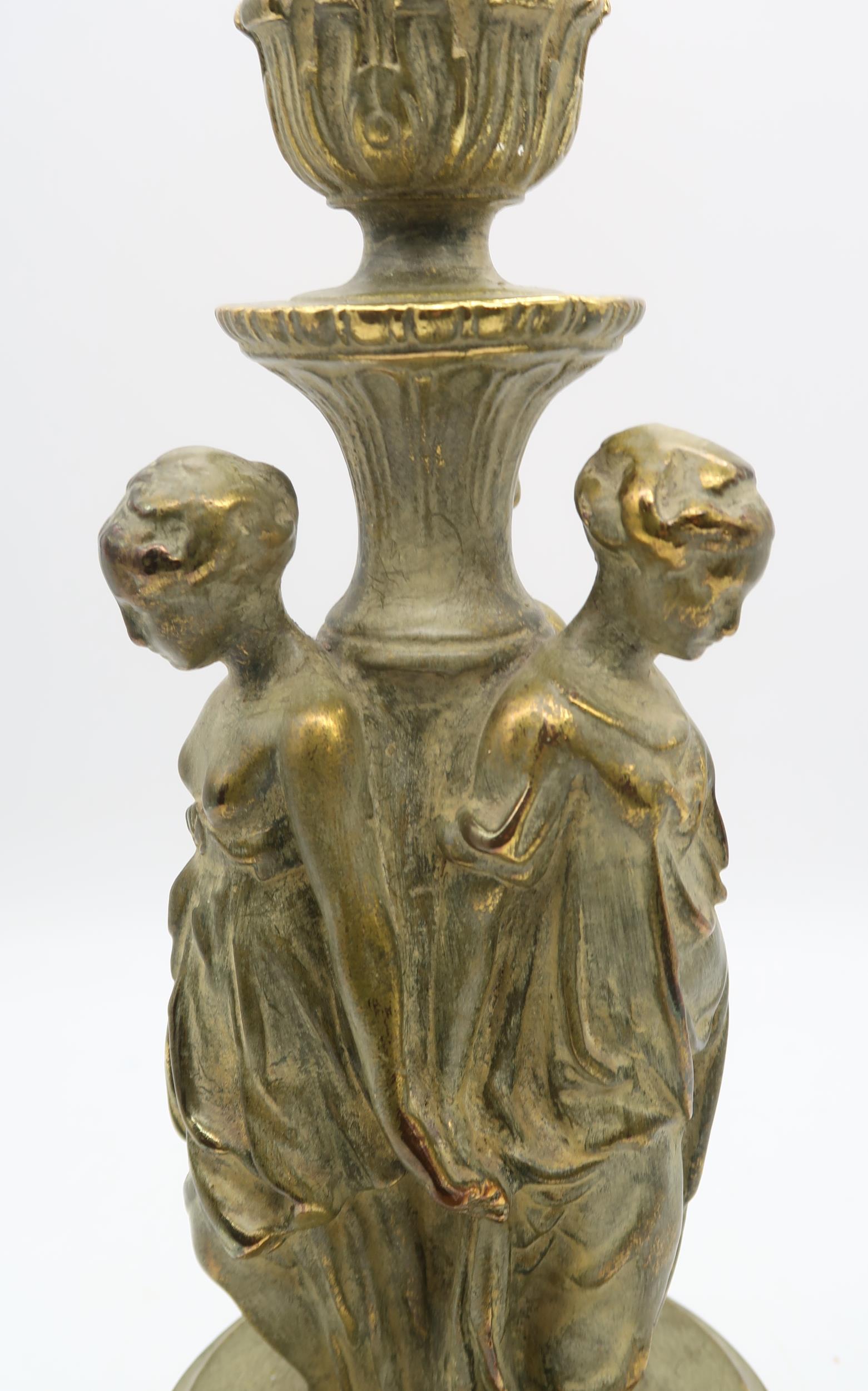A table lamp modelled as the three graces, upon onyx base Condition Report:Available upon request - Image 2 of 2