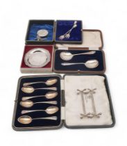 A collection of silver including cased teaspoons, Birmingham, a silver pin dish, by DH & S,
