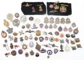 A mixed collection of military and civilian badges, to include five hallmarked silver ARP lapel/