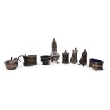 A collection of silver including salts and peppers and part cruet sets, various dates and makers,