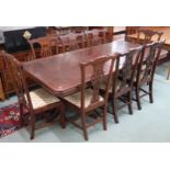 A 20th century dining suite comprising twin pedestal extending dining table, 77cm high x 166cm