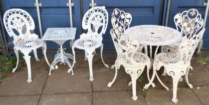 A lot comprising contemporary cast metal garden table and four chair, two further cast metal