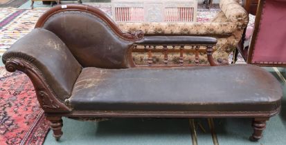 A late Victorian continental walnut framed chaise longue with humped spinel back and scrolled end on