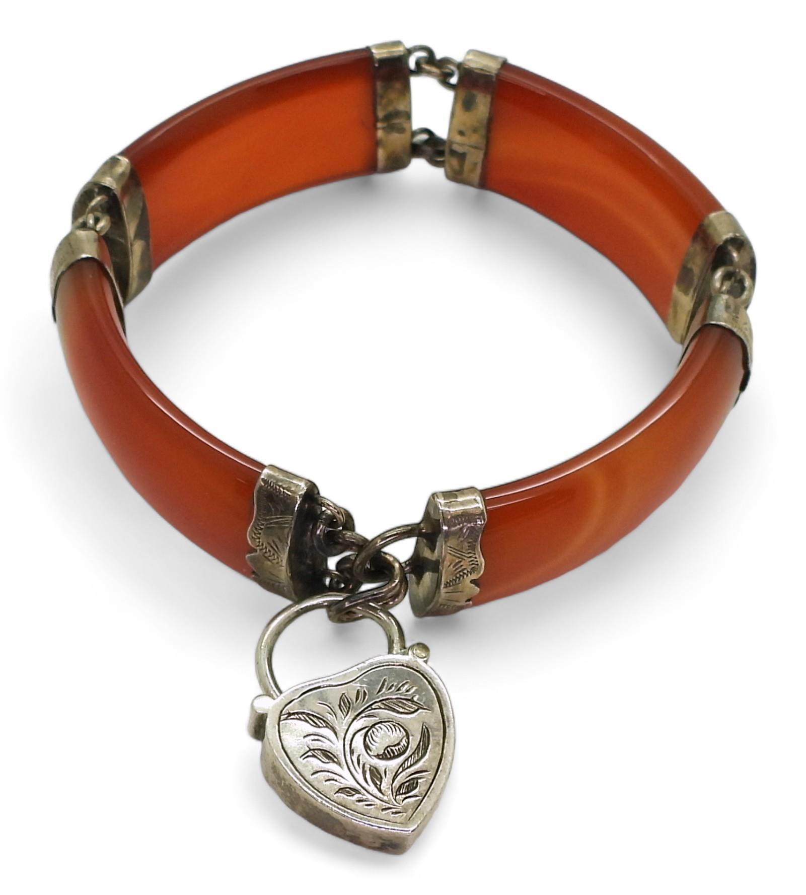 A Scottish carnelian bracelet with heart shaped carnelian set clasp, mounted throughout in