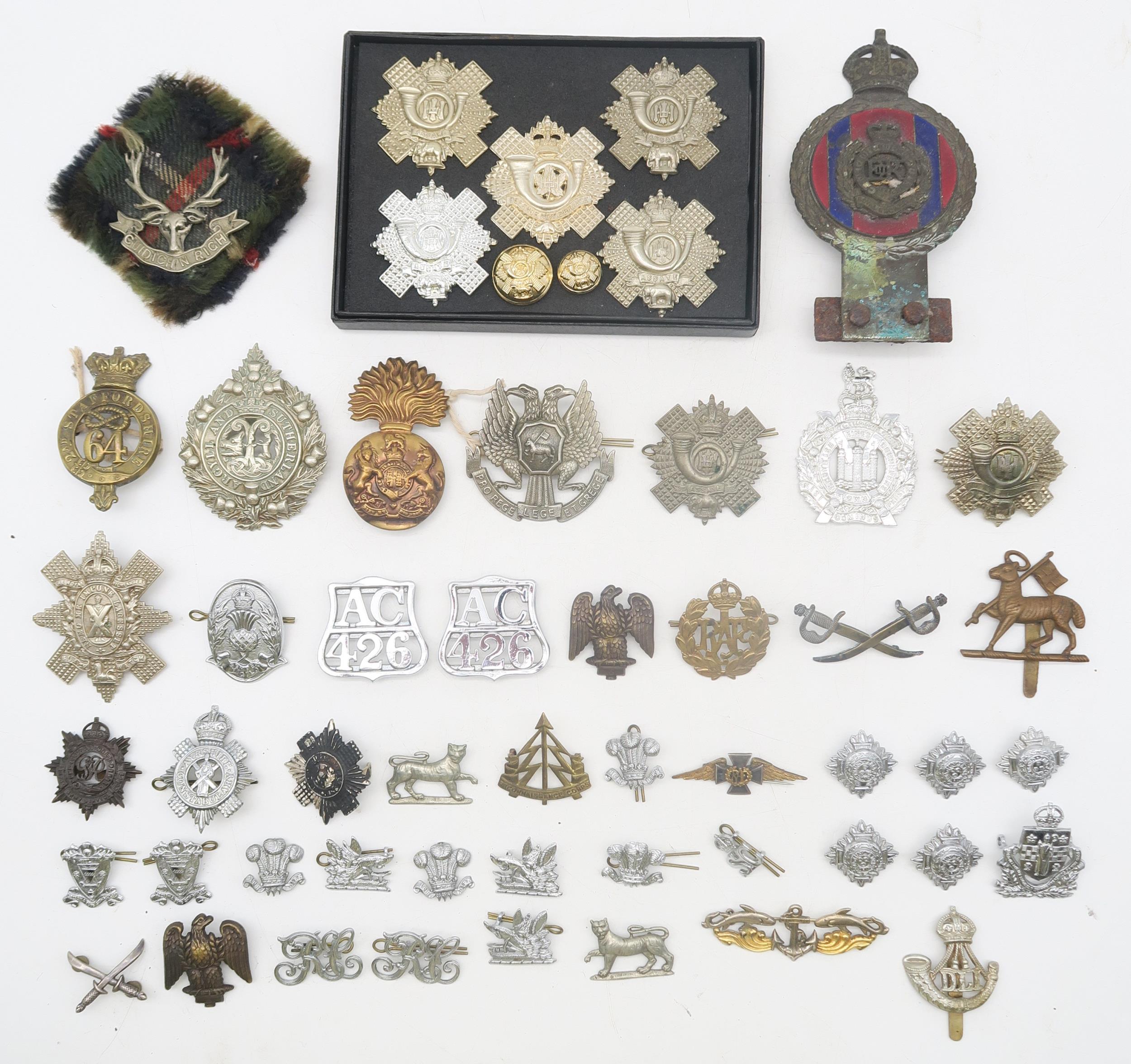 A collection of military cap and other badges, to include the Seaforth Highlanders, Black Watch,