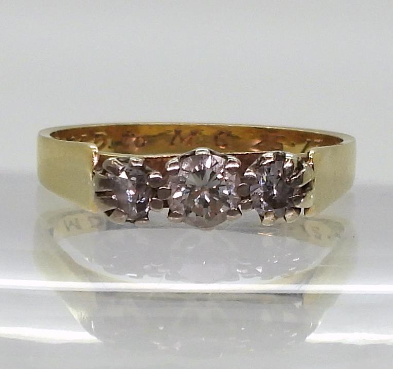An 18ct gold three stone diamond ring set with estimated approx 0.50cts of brilliant cut diamonds, - Image 2 of 5