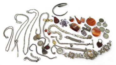 A collection of silver and white metal fob chains, silver pendant coins, a carnelian heart shaped