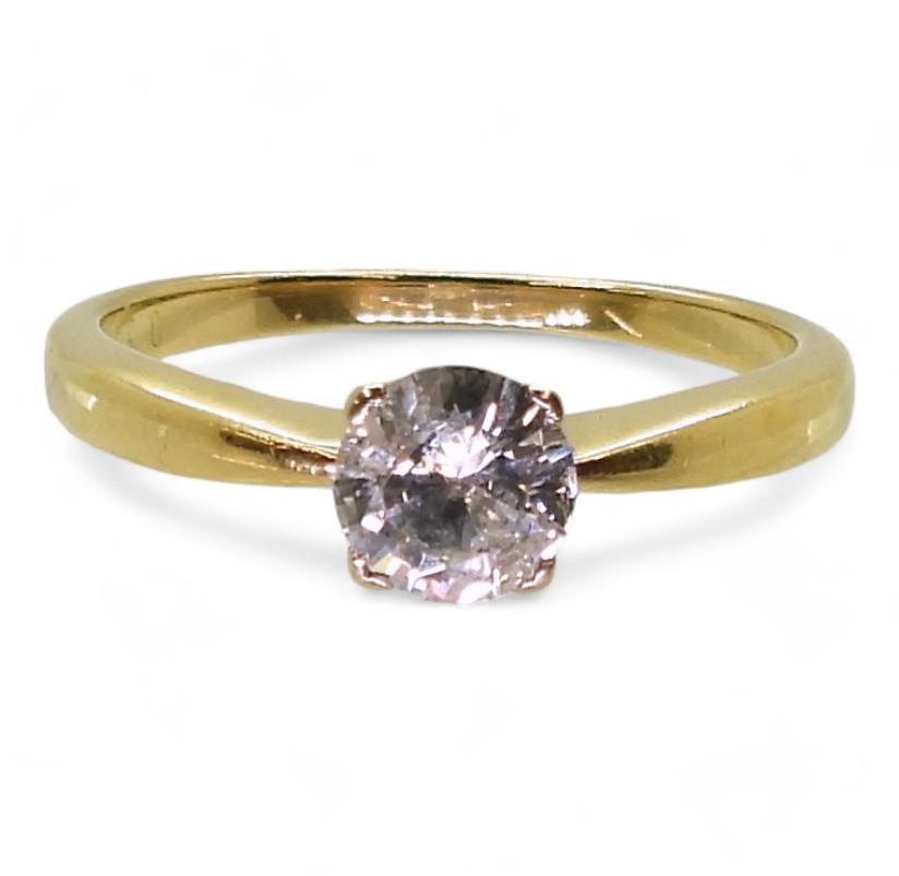 An 18ct gold diamond solitaire ring of estimated approx 0.60cts, size Q1/2, weight 3.4gms