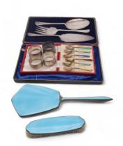 A cased set of silver gilt harlequin guilloche enamel demitasse spoons, Birmingham, four silver