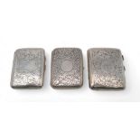Three silver cigarette cases, one by William Neale Ltd, Birmingham, another by Cohen & Cheshire, all