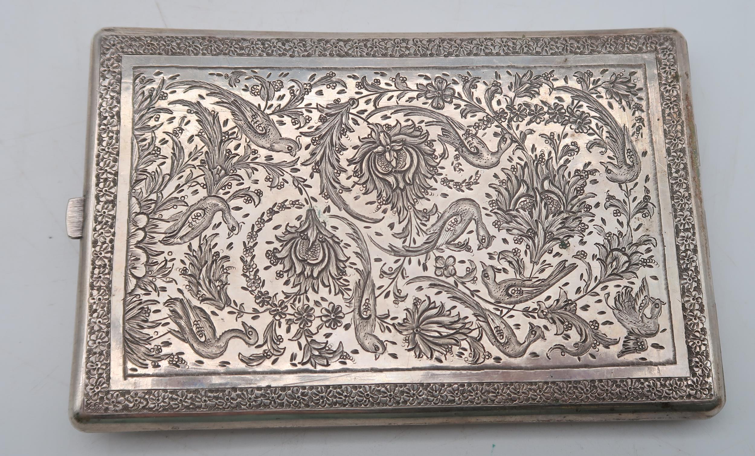 A Persian white metal cigarette case, decorated with birds amongst foliage, and a Myon silver - Image 2 of 2