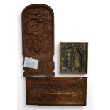 A Ugandan carved mahogany panel depicting village life, together with a gilded carved panel of