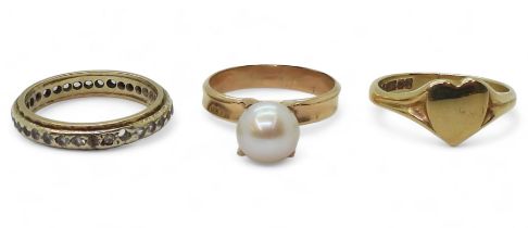 A 9ct gold heart shaped signet ring, size N, a clear gem set eternity ring, size N, and a yellow