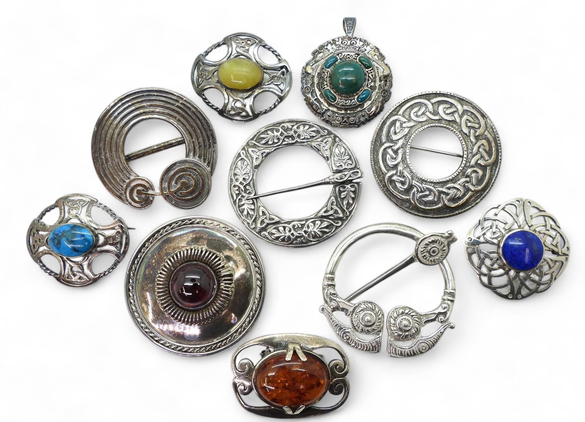 A collection of Celtic style brooches, to include a A & E Ritchie pattern brooch stamped with the