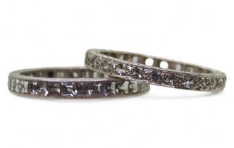 A 9ct white gold clear gem set eternity ring, size O1/2, together  with a similar white metal