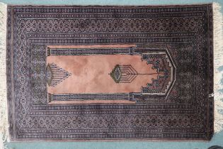 A pink ground Persian style prayer rug with multicoloured borders, 150cm long x 99cm wide  Condition