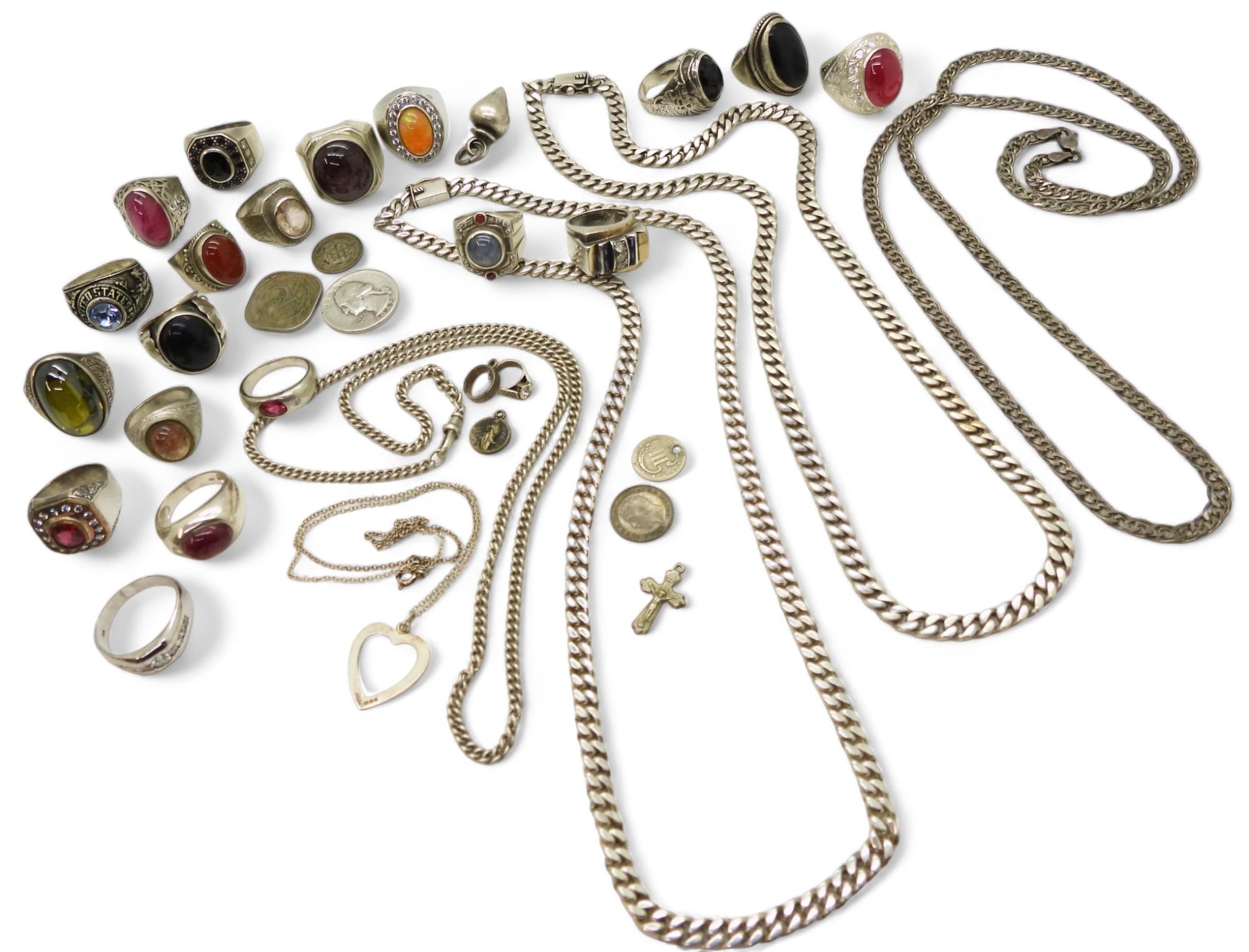 A collection of silver and white metal jewellery to include curb chain necklaces, an Italian