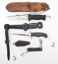 Two rubber-handled diver's-type knives, the larger with blade measuring approx. 13.7cm in length and