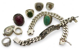 A collection of silver and white metal to include two heavy curb chain bracelets one with a dragon