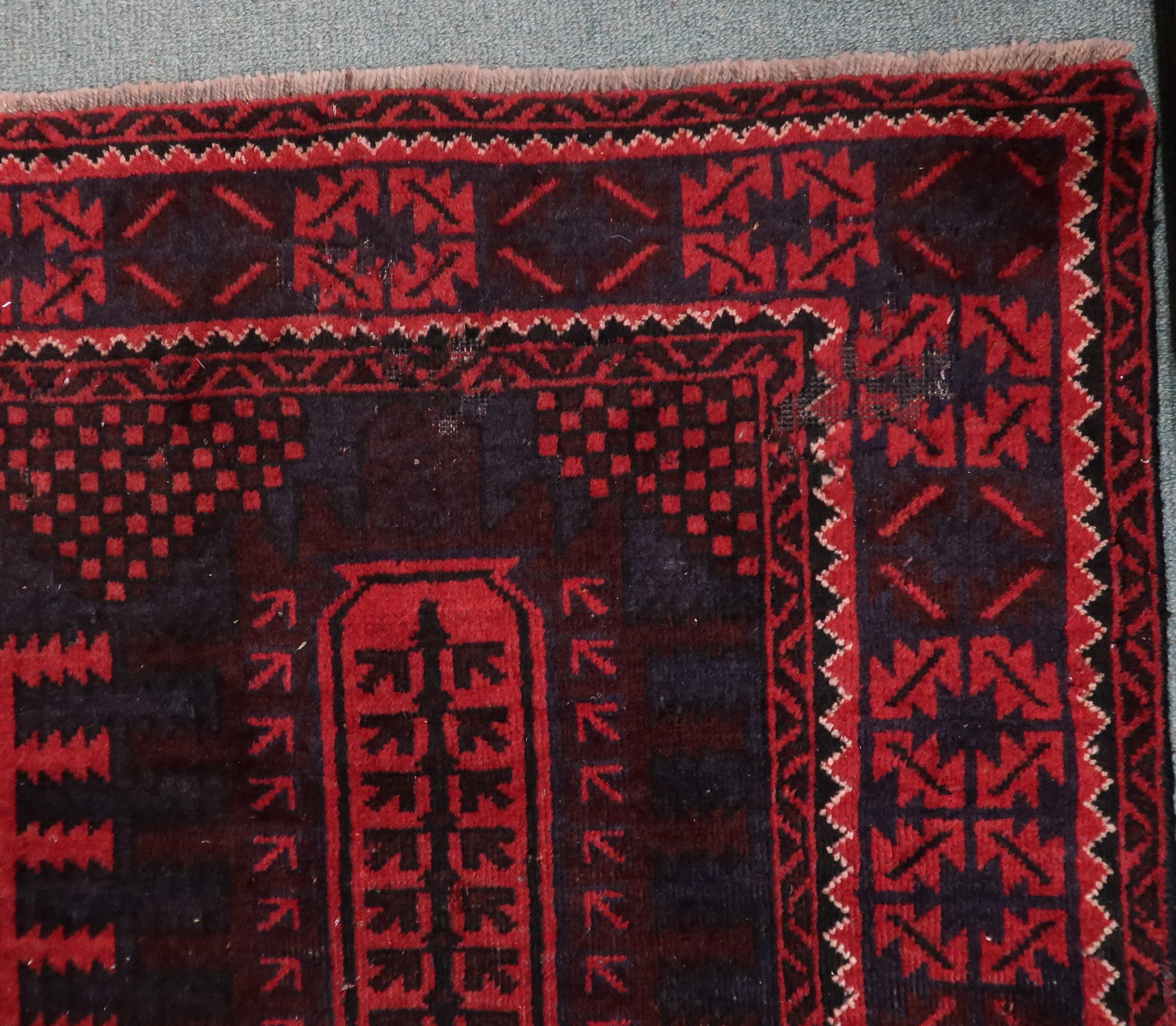 A dark red ground Afghan Bellucci tribal rug with geometric patterned ground within geometric - Image 2 of 3