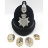 A 1970s/80s Thames Valley Police helmet, together with four gilt metal "police" badges, including