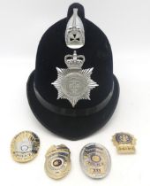 A 1970s/80s Thames Valley Police helmet, together with four gilt metal "police" badges, including