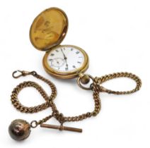 A gold plated pocket watch and chain, with a large Masonic ball charm in yellow and white metal,