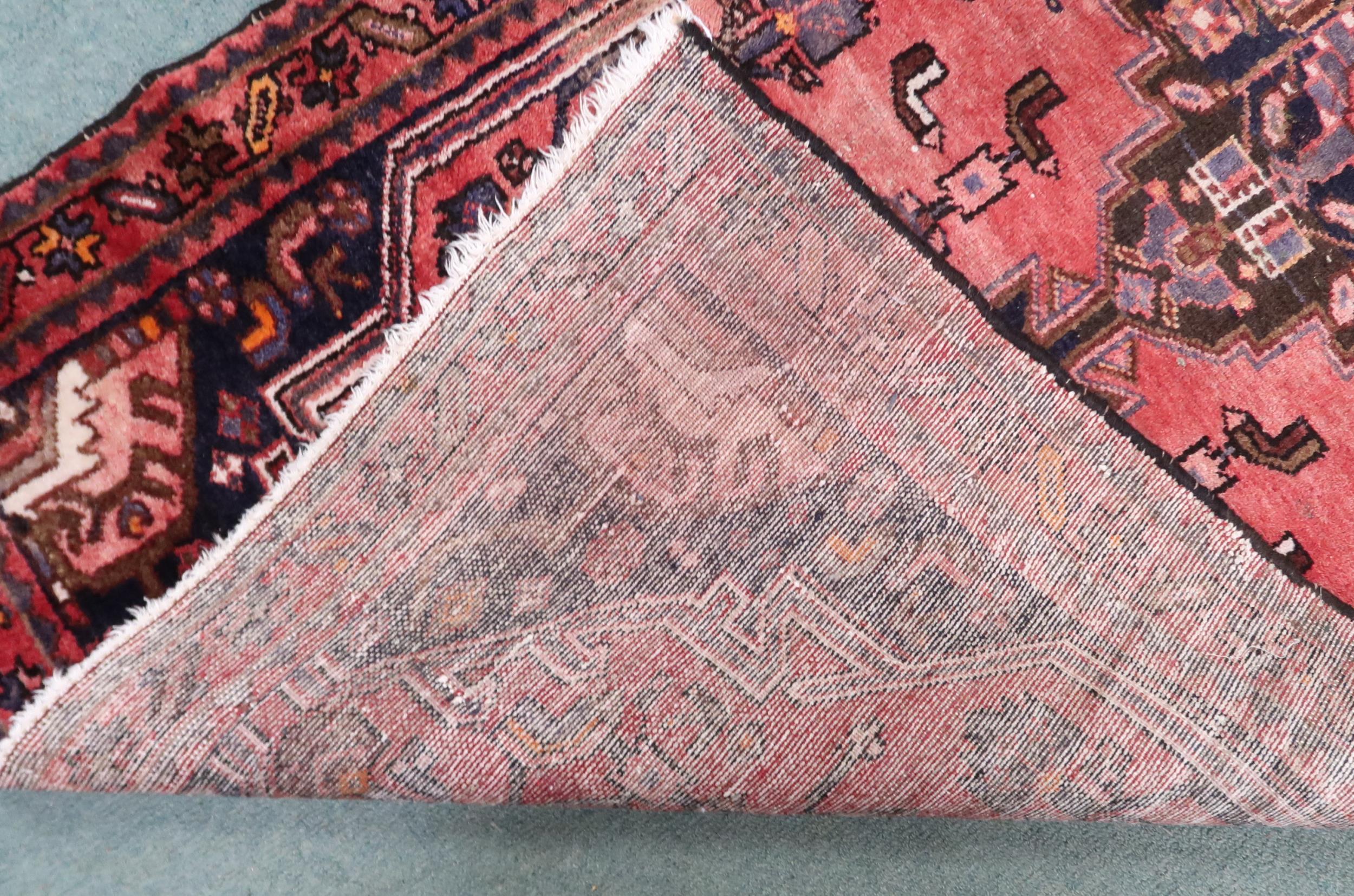 A red ground Hamadan runner with dark central medallion, matching spandrels on floral pattern - Image 4 of 4