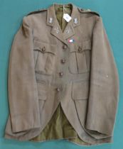 A WW1 Captain's tunic, converted from four-pocket style to Scottish Regimental style, with