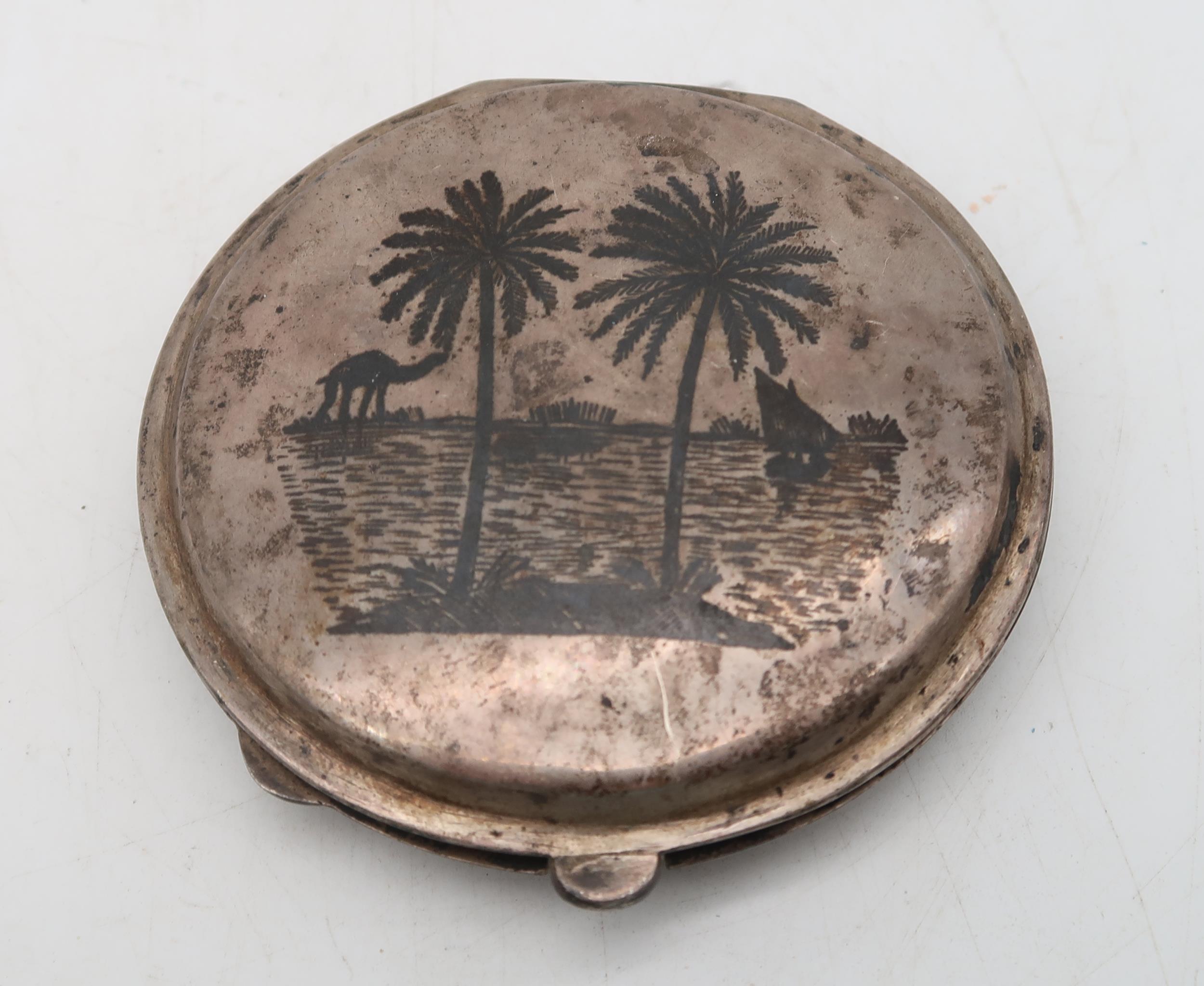 An Egyptian white metal niello filigree powder compact, with decoration of boats to the lid and palm - Image 4 of 4