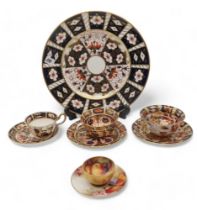 Two Royal Crown Derby cups and saucers, a plate, another imari cup and saucer and a Royal