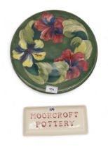 A Moorcorft pottery Hibiscus pattern charger together with a pin tray Condition Report:Available