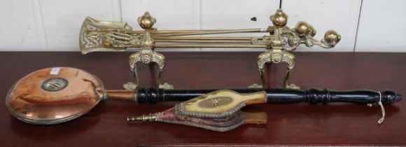 A lot comprising early 20th century brass fire service comprising pair of fire dogs, tongs, shovel