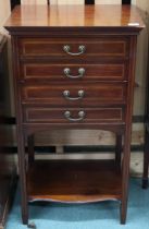 An Edwardian mahogany four drawer music cabinet with square supports joined by lower tier shelf,