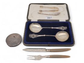 A cased set of serving spoons, by Joseph Rodgers & Sons, Sheffield, with openwork terminals,