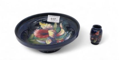 A Moorcroft orchid pattern bowl, together with a miniature orchid pattern vase Condition Report: