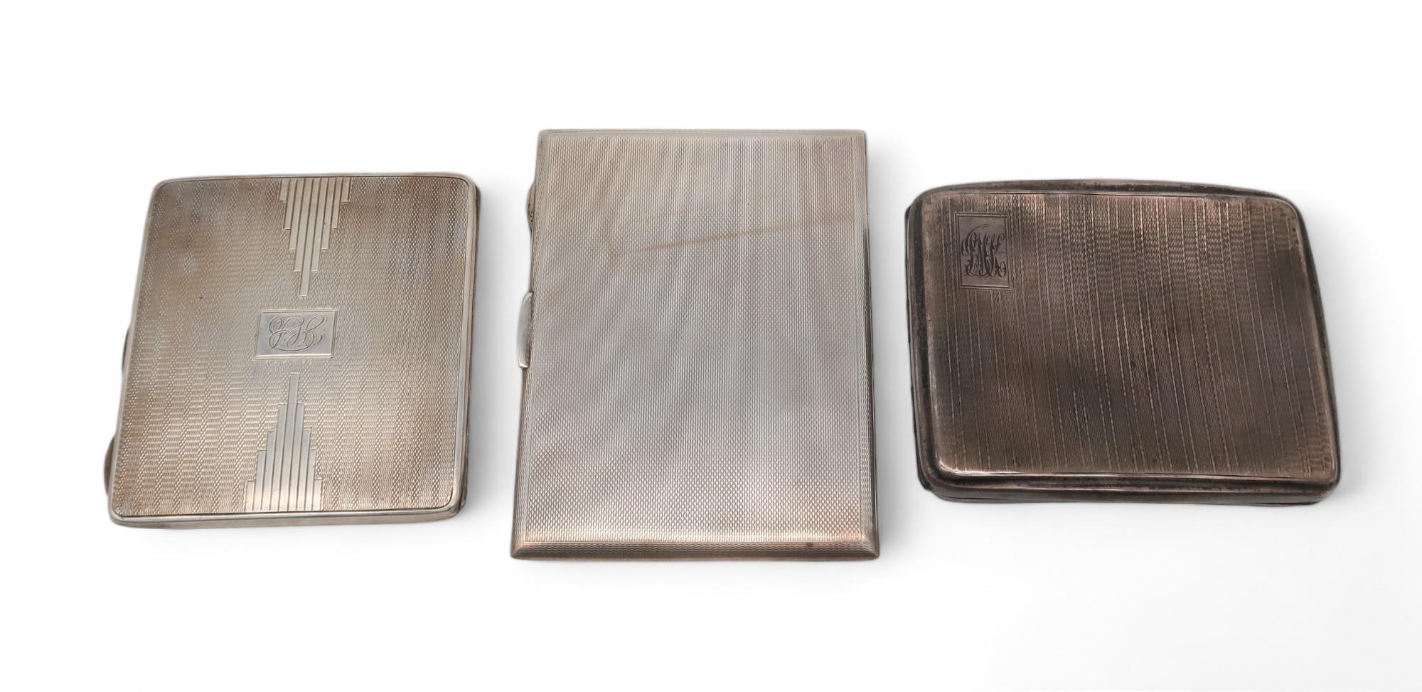 Three silver cigarette cases, one by Joseph Gloster ltd, Birmingham 1933, another by John Round,