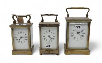 Three brass and glass carriage clocks Condition Report:Available upon request